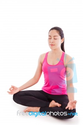 Beautiful Young Woman Practicing Yoga, Sitting In A Lotus Position. Isolated On White Stock Photo