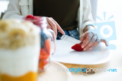 Beautiful Young Woman Preparing Breakfast At Home Stock Photo