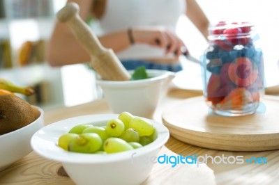 Beautiful Young Woman Preparing Breakfast At Home Stock Photo