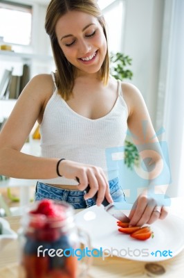 Beautiful Young Woman Preparing Breakfast At Home Stock Photo