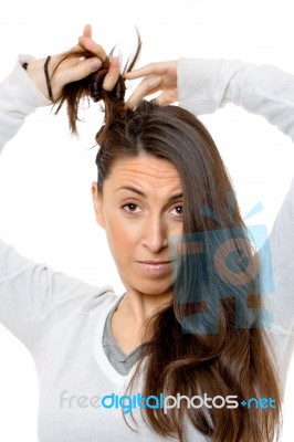 Beautiful Young Woman Touching His Hair Stock Photo