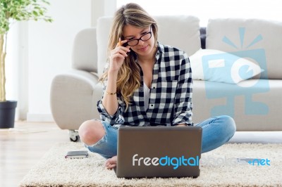 Beautiful Young Woman Using Her Laptop At Home Stock Photo