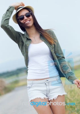 Beautiful Young Woman Walking In The Park Stock Photo