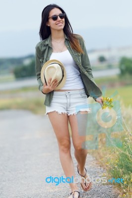 Beautiful Young Woman Walking In The Park Stock Photo