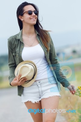 Beautiful Young Woman Walking In The Park Stock Photo