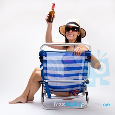 Beautiful Young Woman With Bikini Sitting On A Beach Chair Stock Photo Royalty Free Image Id 100361574