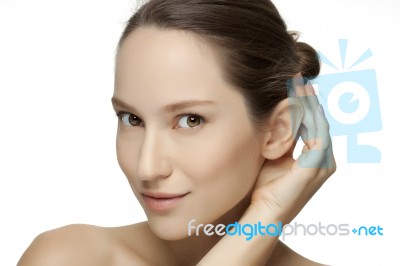 Beautiful Young Woman With Clean Skin Of The Face Stock Photo