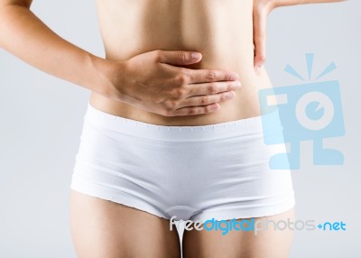 Beautiful Young Woman With Hands On Belly-stomach Ache Stock Photo