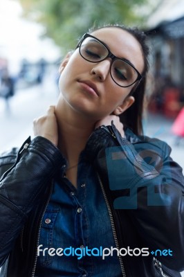 Beautiful Young Woman With Neck Pain In The Street Stock Photo