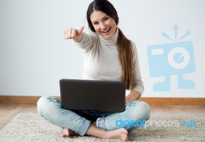 Beautiful Young Woman Working On Her Laptop At Home Stock Photo