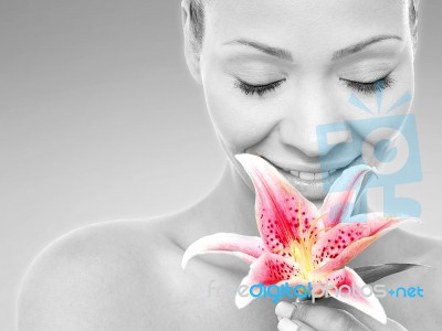 Beauty Woman With A Lily Flower Stock Photo