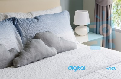 Bed And Pillows With White Lamp Stock Photo