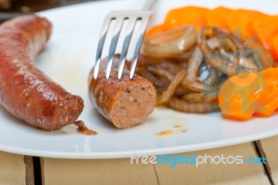 Beef Sausages Cooked On Iron Skillet Stock Photo