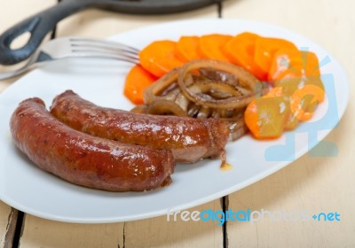 Beef Sausages Cooked On Iron Skillet Stock Photo