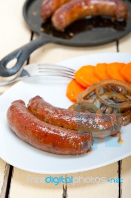 Beef Sausages Cooked On Iron Skillet Stock Photo