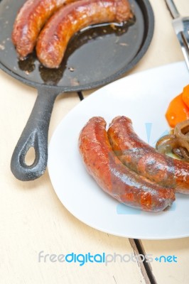 Beef Sausages Cooked On Iron Skillet Stock Photo