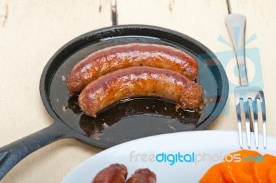 Beef Sausages Cooked On Iron Skillet Stock Photo