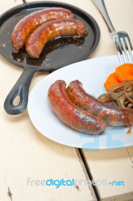 Beef Sausages Cooked On Iron Skillet Stock Photo