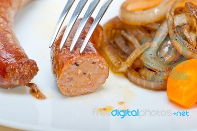 Beef Sausages Cooked On Iron Skillet Stock Photo