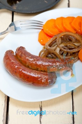 Beef Sausages Cooked On Iron Skillet Stock Photo