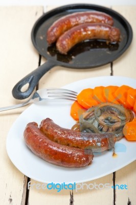 Beef Sausages Cooked On Iron Skillet Stock Photo