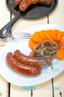 Beef Sausages Cooked On Iron Skillet Stock Photo