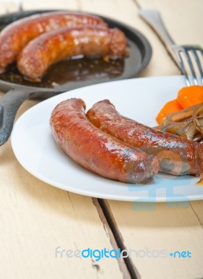 Beef Sausages Cooked On Iron Skillet Stock Photo