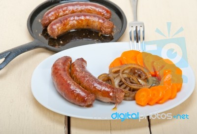 Beef Sausages Cooked On Iron Skillet Stock Photo