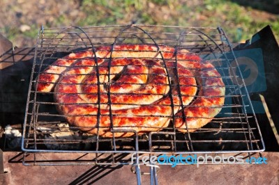 Beef Sausages Grilled On A Coals. Kielbasa Barbecue Stock Photo