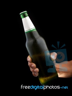 Beer Bottle In Hand Stock Photo