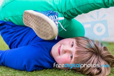 Bent Girl Lying On Her Back Stock Photo