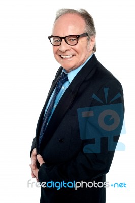 Bespectacled Businessman Posing Sideways Stock Photo