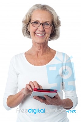 Bespectacled Lady Posing With Tablet Pc Stock Photo