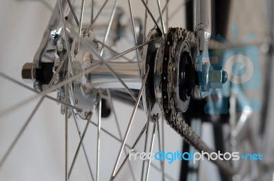 Bicycle's Detail View Of Rear Wheel With Chain & Sprocket Stock Photo