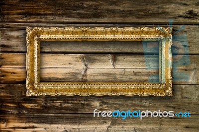 Big Old Gold Picture Frame On Wooden Background Stock Photo