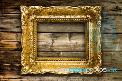 Big Old Gold Picture Frame On Wooden Background Stock Photo