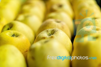 Big Stack Of Yellow Apples Stock Photo