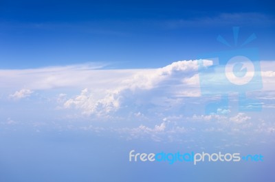 Big White Cloud And Blue Sky Background,view From Airplane Stock Photo