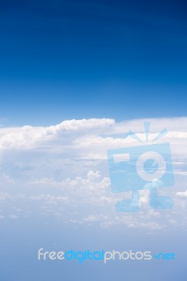 Big White Cloud And Blue Sky Background,view From Airplane Stock Photo