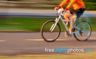 Biker On The Road With Motion Blur Stock Photo