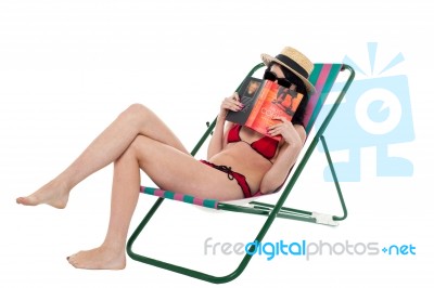 Bikini Lady Hiding Her Face With A Book Stock Photo