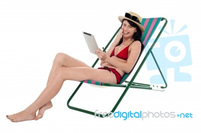 Bikini Woman Holding Touch Screen Tablet Device Stock Photo