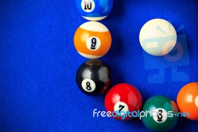 Billiard Balls In A Blue Pool Table Stock Photo