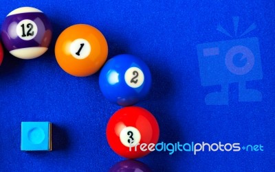 Billiard Balls In A Blue Pool Table Stock Photo