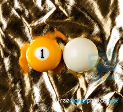 Billiard Balls On Golden Surface Stock Photo