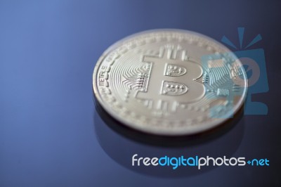 Bitcoin Curency Dof On Blue Light Background Stock Photo