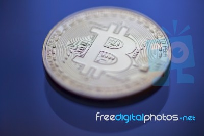 Bitcoin Curency Dof On Blue Light Background Stock Photo