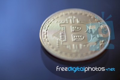 Bitcoin Curency Dof On Blue Light Background Stock Photo