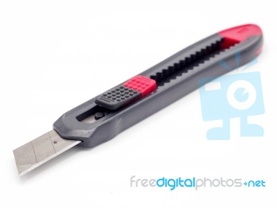 Black And Red Plastic Cutter Knife Isolated Stock Photo