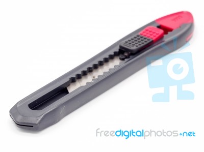 Black And Red Plastic Cutter Knife Isolated Stock Photo